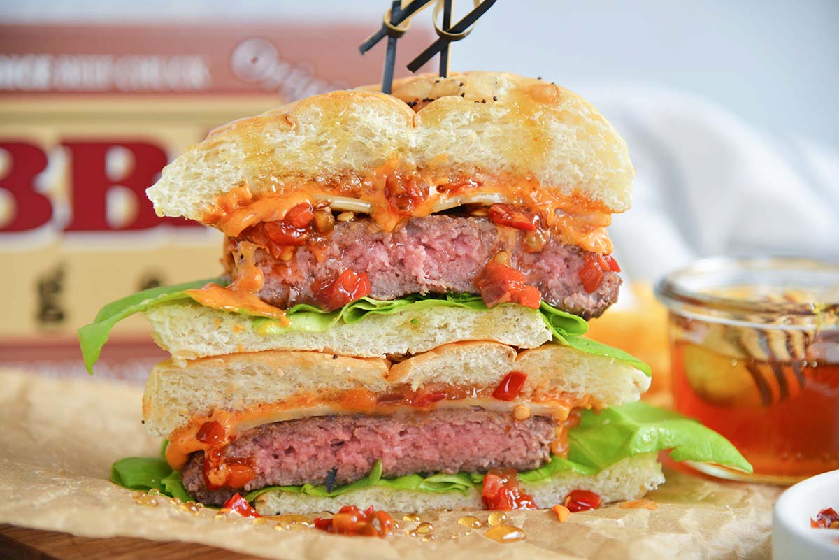 head on image of a sliced hot honey burger