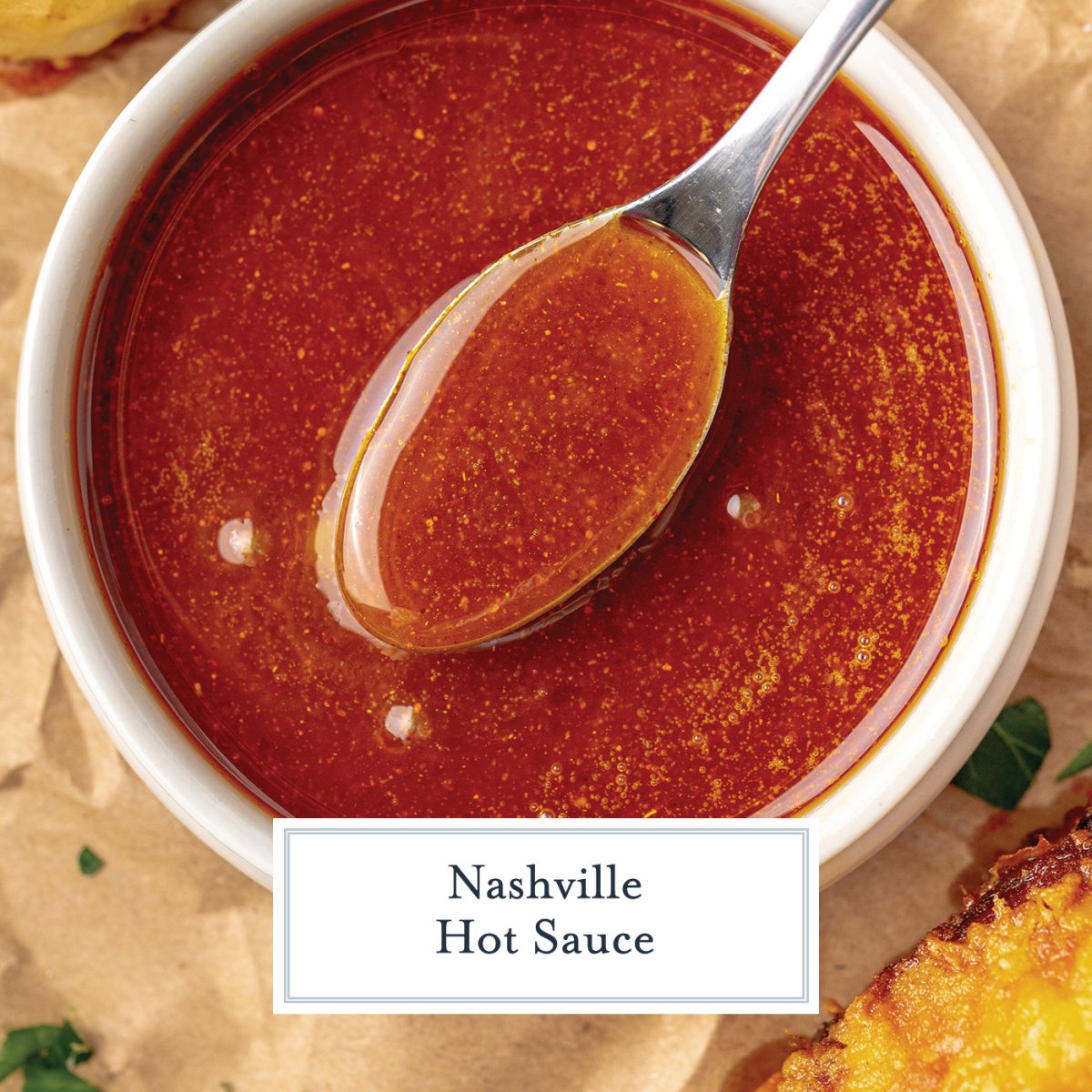 spoon in a white bowl of nashville hot sauce 