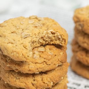 stack of peanut butter oatmeal cookies with bite taken out of top one