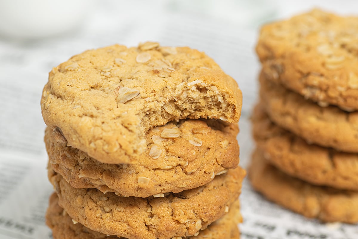 stack of peanut butter oatmeal cookies with bite taken out of top one