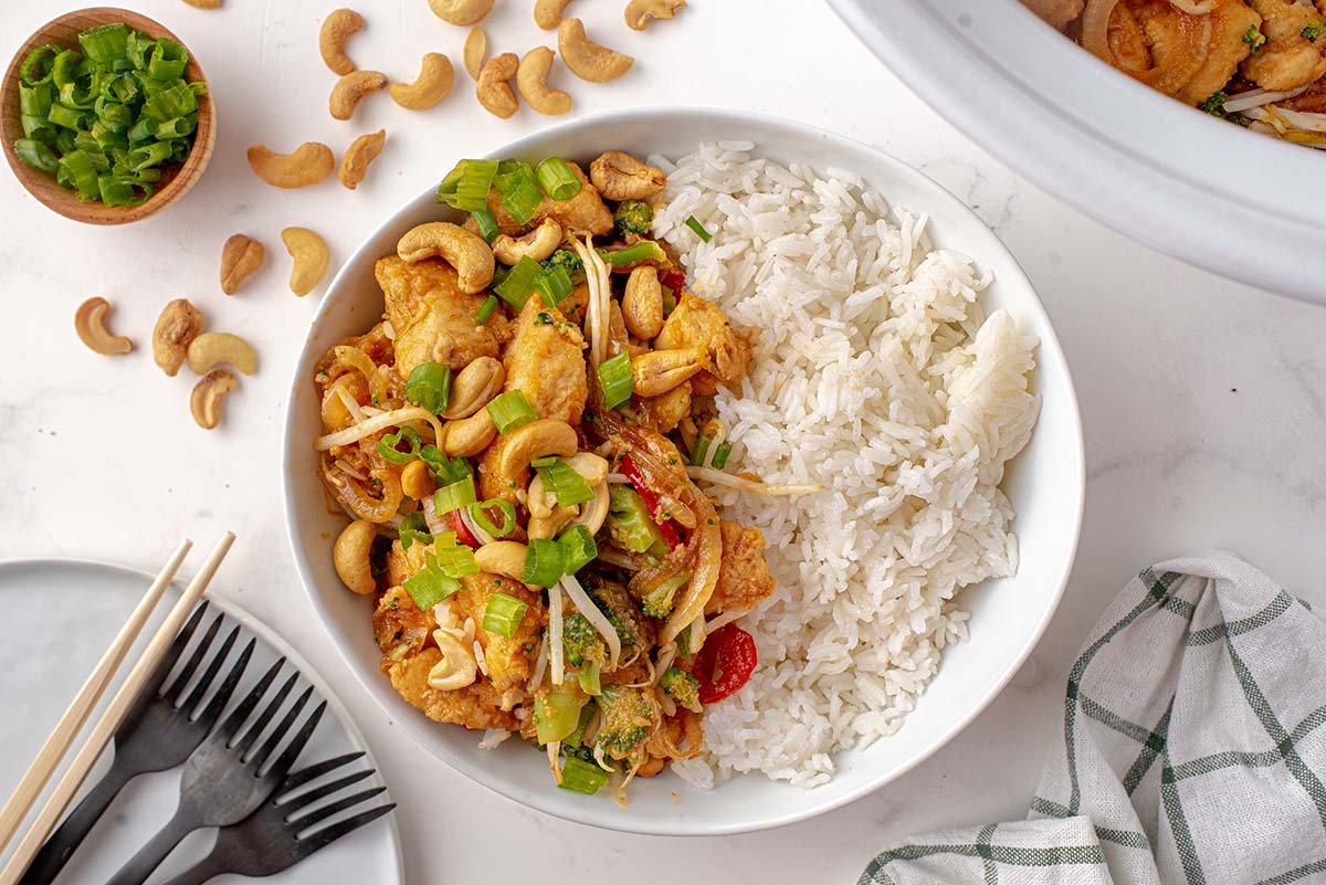 chicken with cashews and rice in a serving bowl  