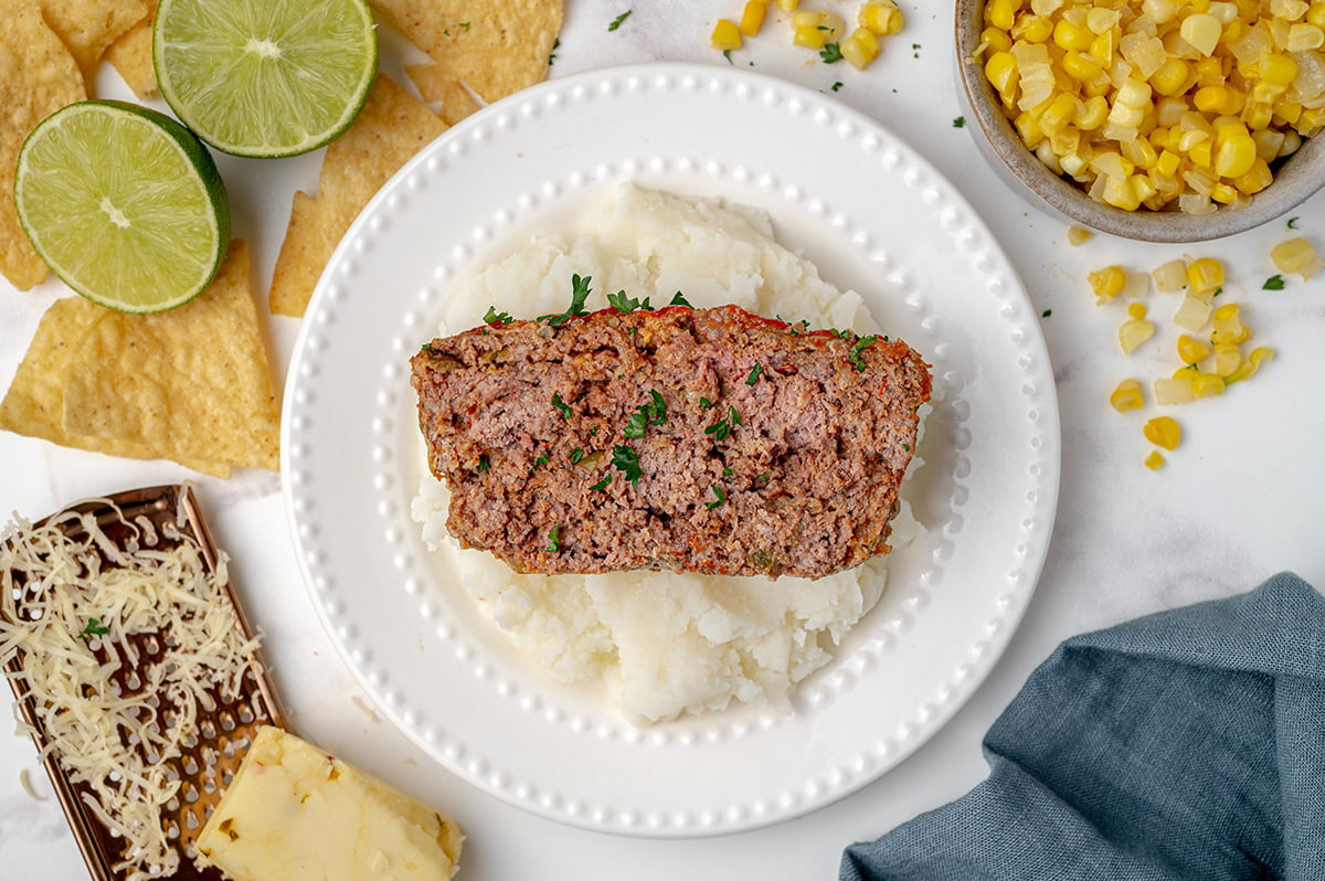 one slice of southwest meatloaf over mashed potatoes