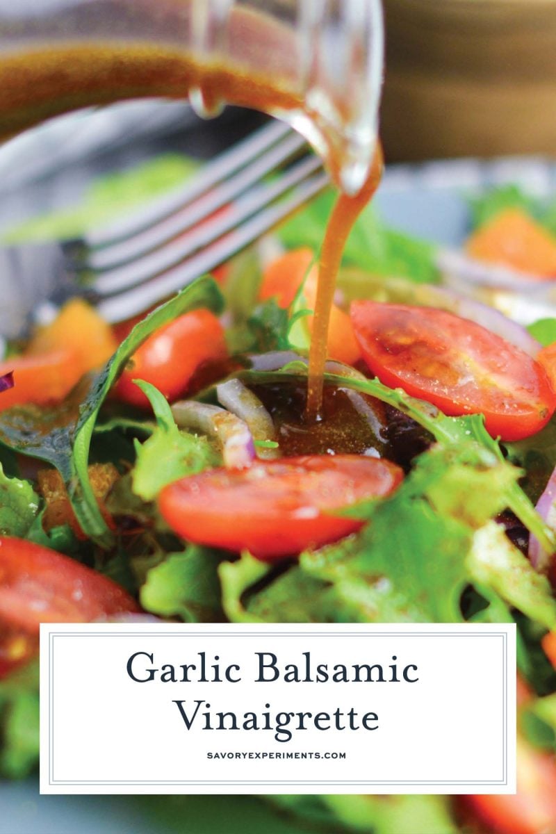 garlic balsamic vinaigrette poured onto salad