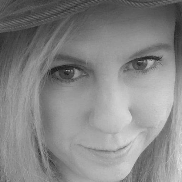 close up shot of woman smiling at camera