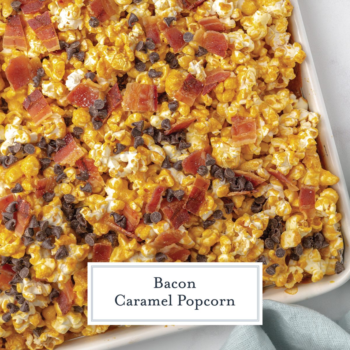 overhead shot of bacon caramel popcorn on sheet pan with text overlay for facebook