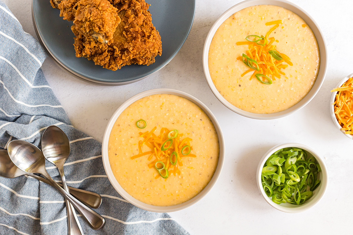 overhead shot of two bowls of cheddar grits