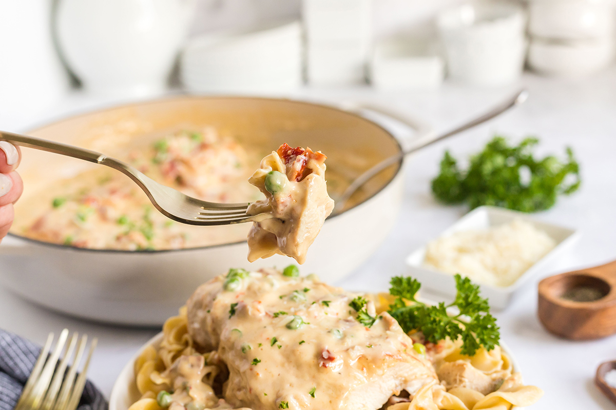 bite of creamy garlic chicken on fork