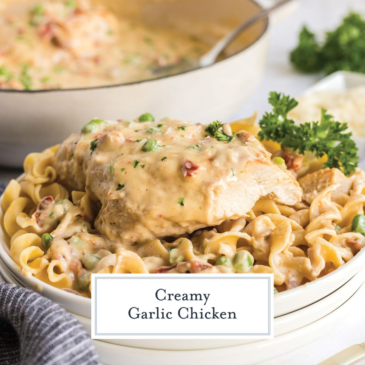 creamy garlic chicken over noodles on white plate with text overlay for facebook