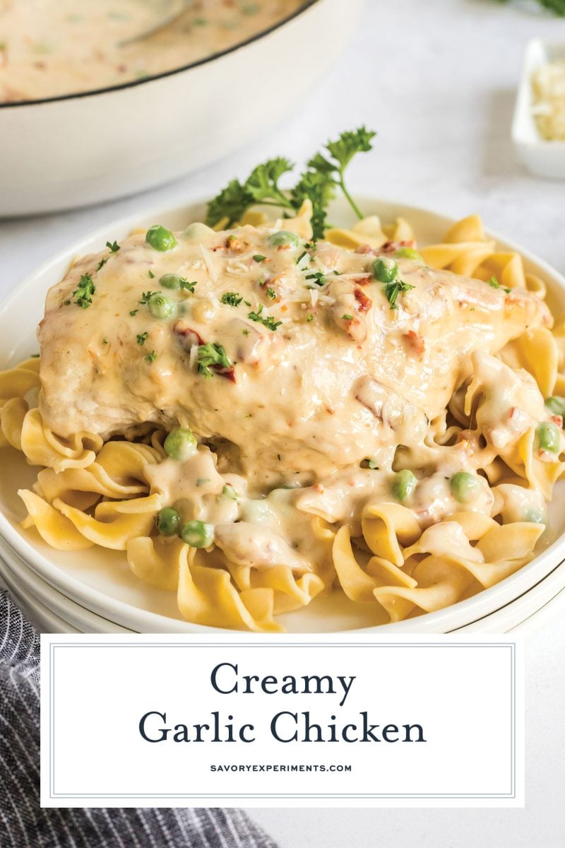 creamy garlic chicken over egg noodles with text overlay for pinterest