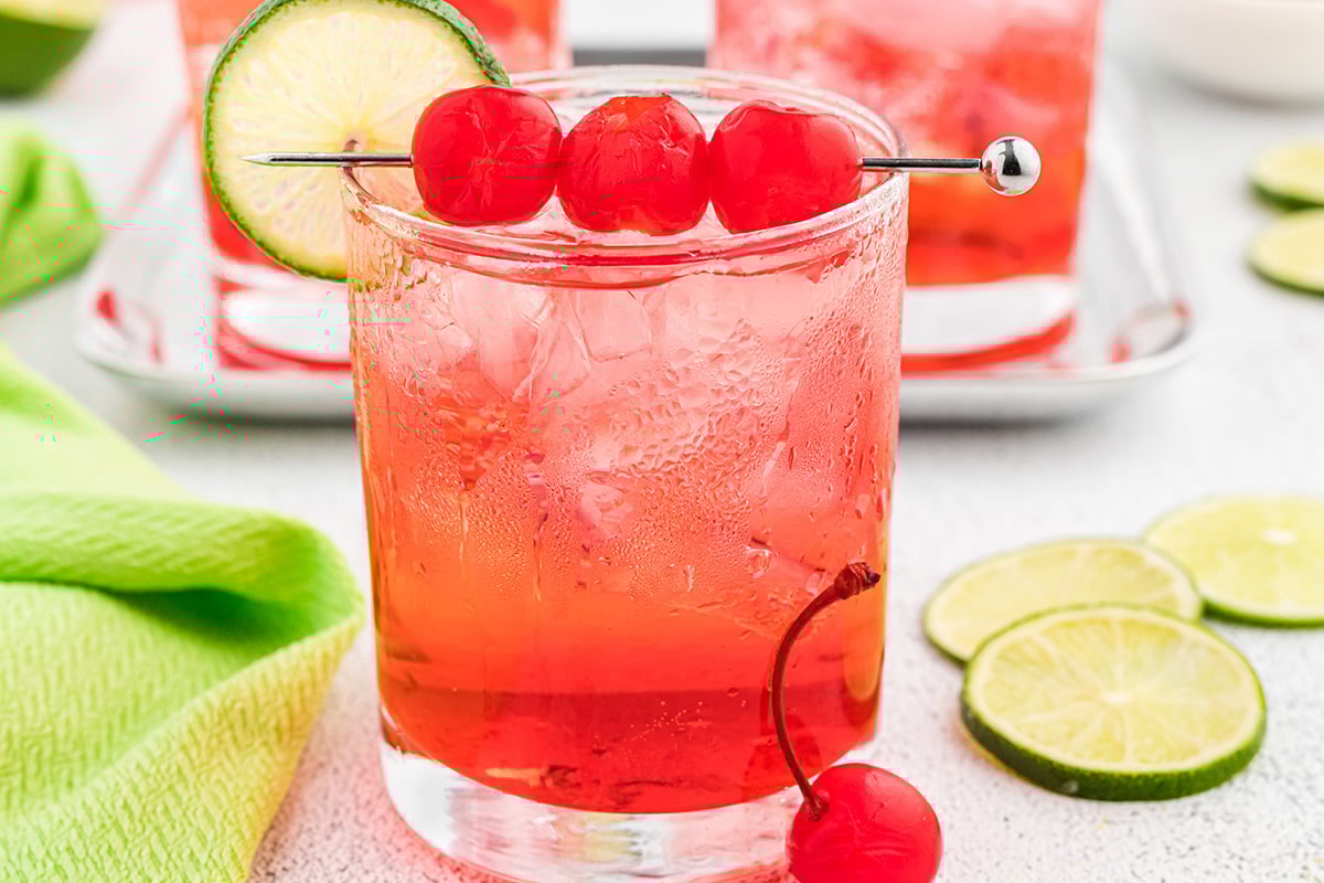 close up of dirty shirley with three cherries
