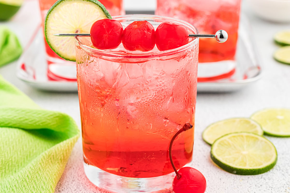 close up of dirty shirley with three cherries