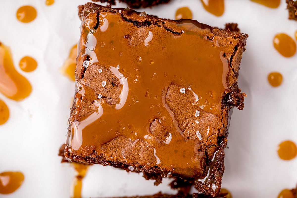 close up of a brownie with caramel drizzle 