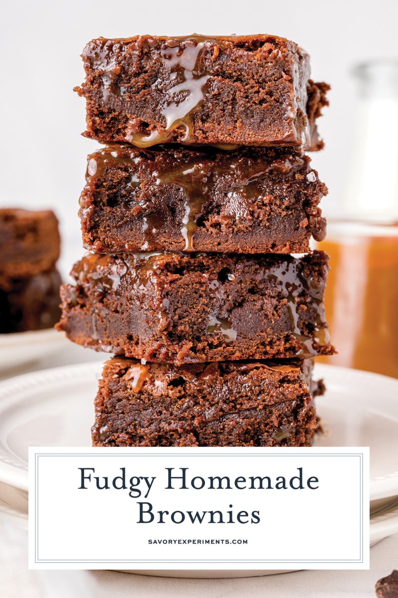 stack of four fudgy brownies with sauce 