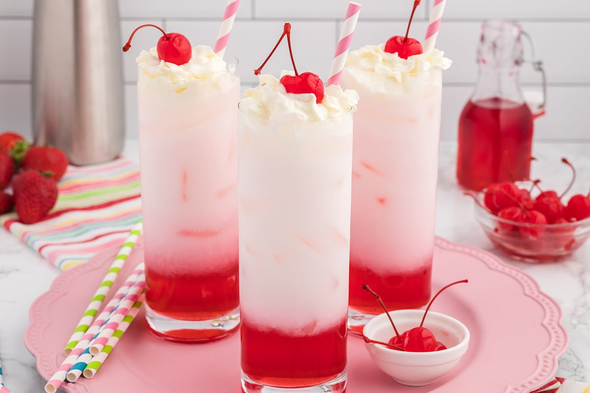 fruity Italian cream sodas on a pink serving platter 