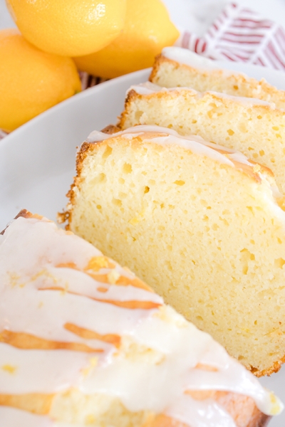 lemon pound cake sliced on a plate