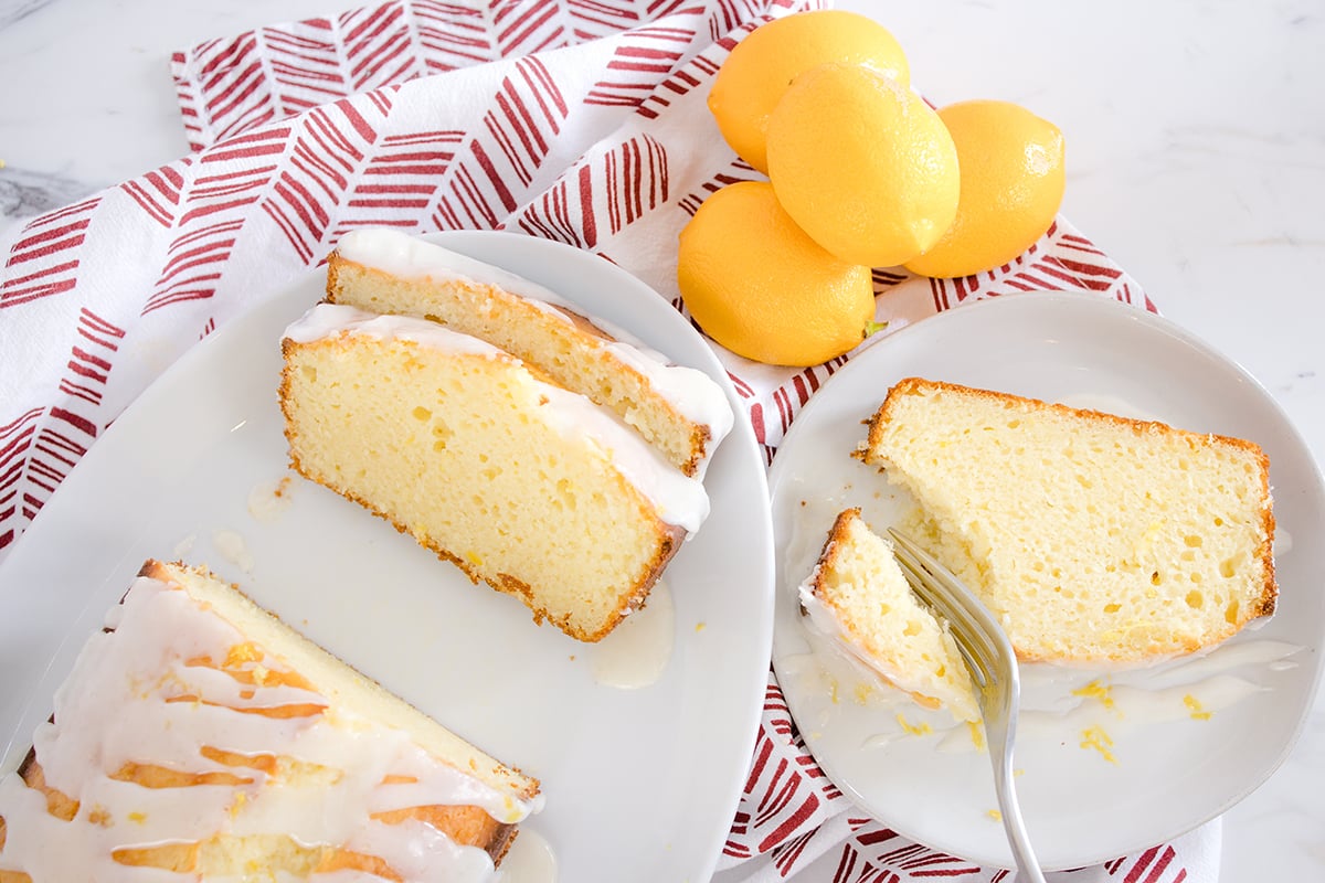 fork cutting into slice of lemon pound cake