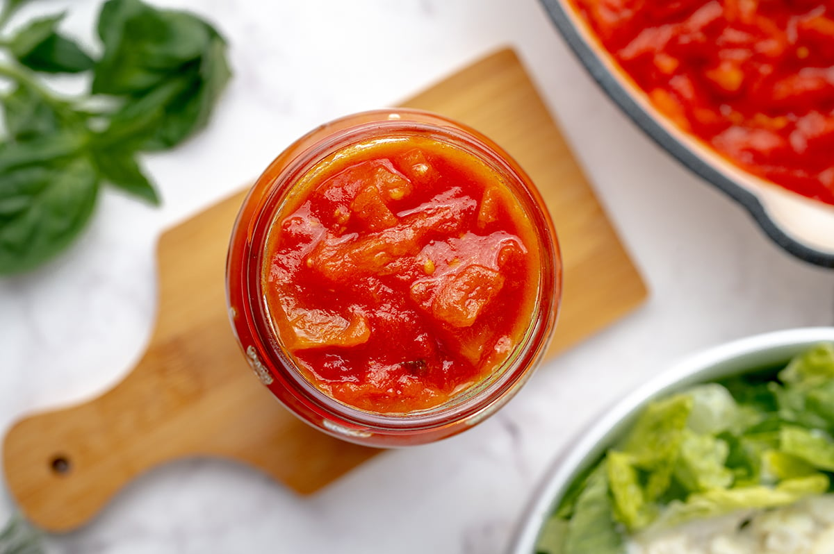 overhead shot of marinara in a jar