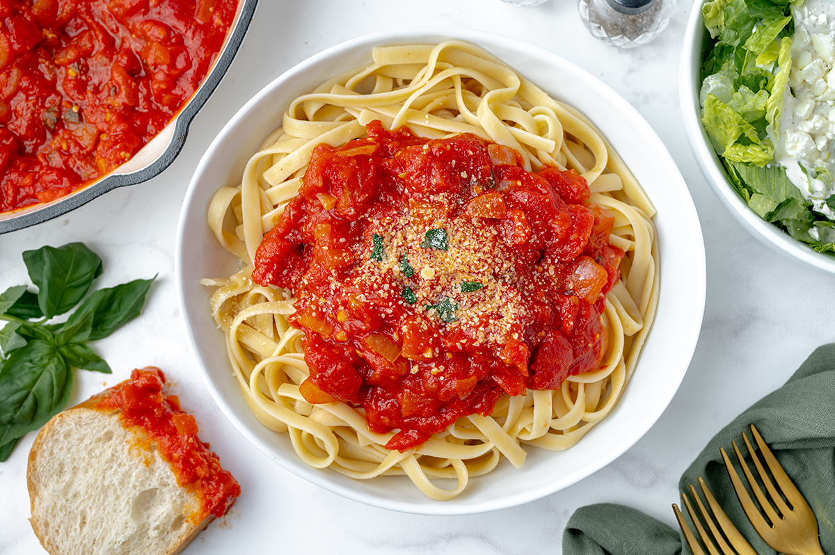 marinara sauce over pasta in a bowl