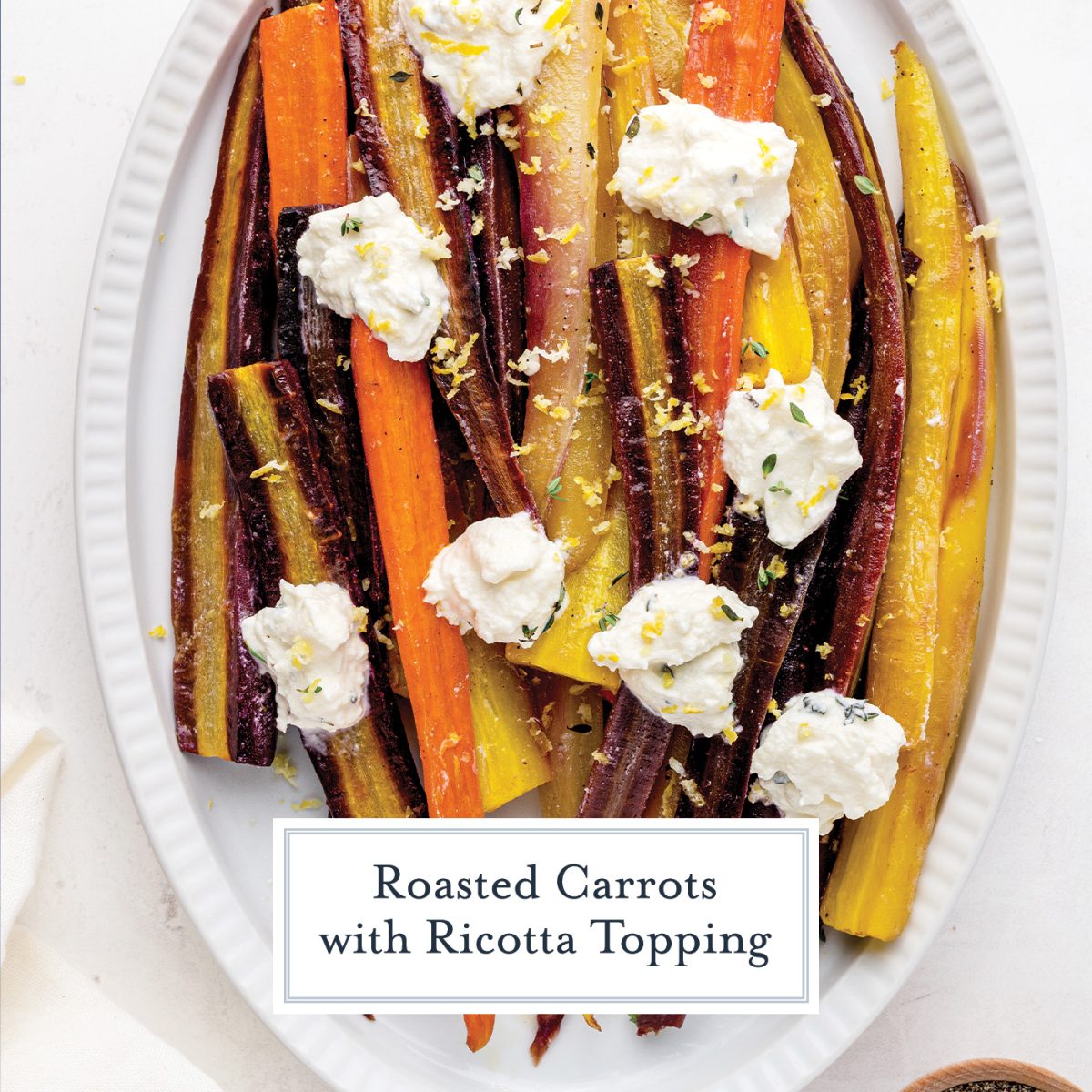 close up of whole roasted carrots with ricotta and lemon zest 