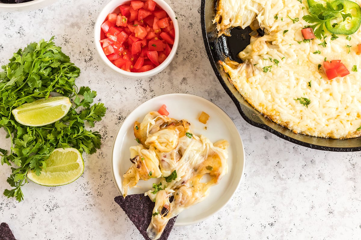 plate with a chip dipped into queso fundido