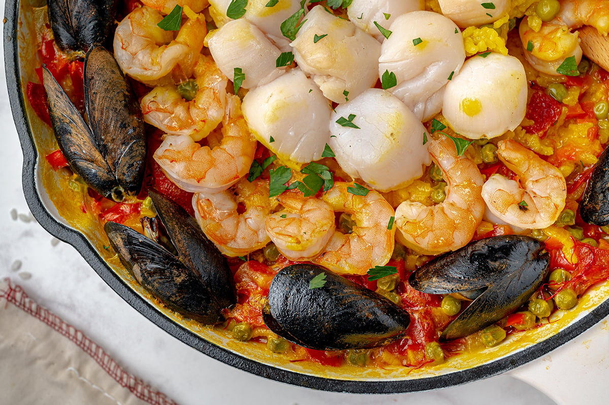 close up of seafood in paella 