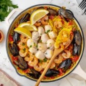 overhead of seafood paella recipe in a cast iron skillet