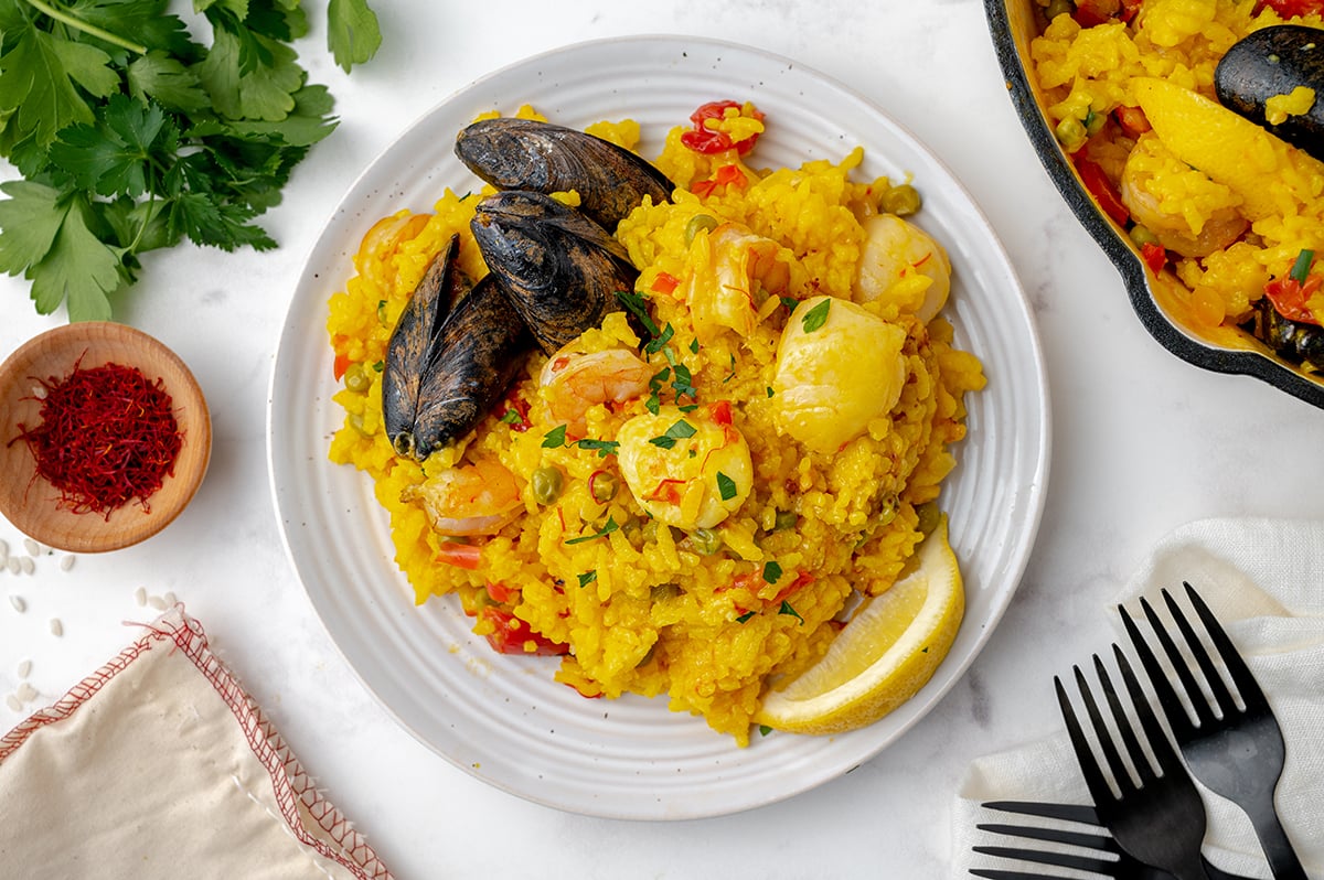 seafood paella on a white dining plate 