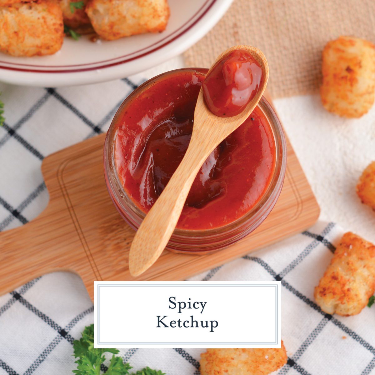 spicy ketchup in a small glass bowl with a wood spoon