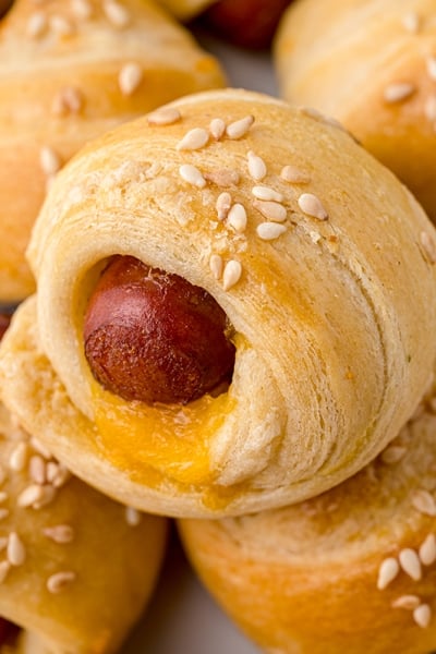 close up of a cheesy pig in a blanket