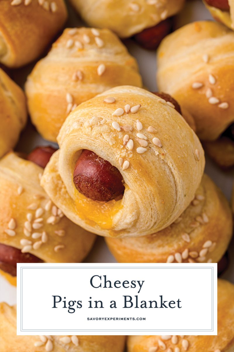 close up of pigs in a blanket with sesame seeds 