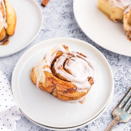 cinnamon roll on white plate