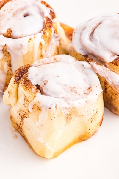 three cinnamon rolls on a plate