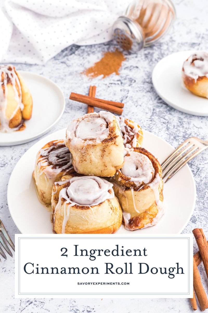 five cinnamon rolls on a plate with text overlay for pinterest