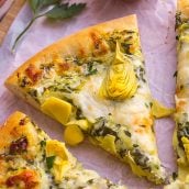 one slice of spinach artichoke pizza