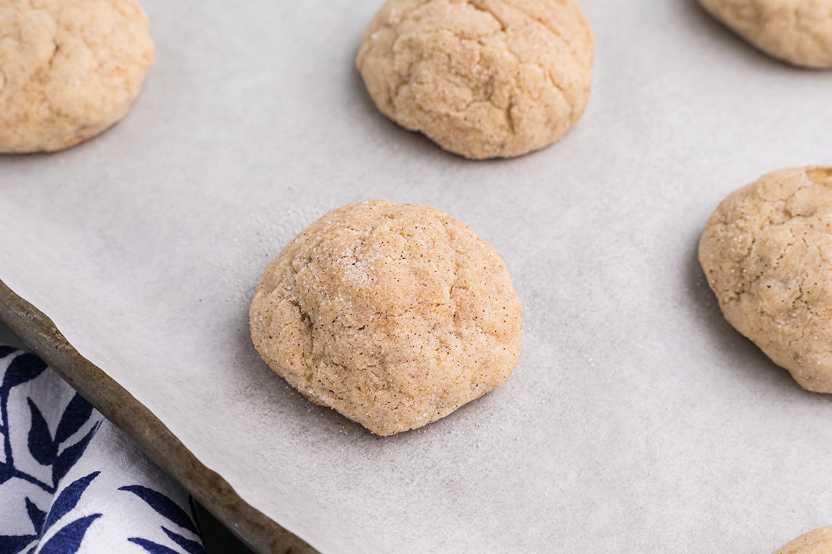 soft banana cookies on a parchment lined baking sheet 