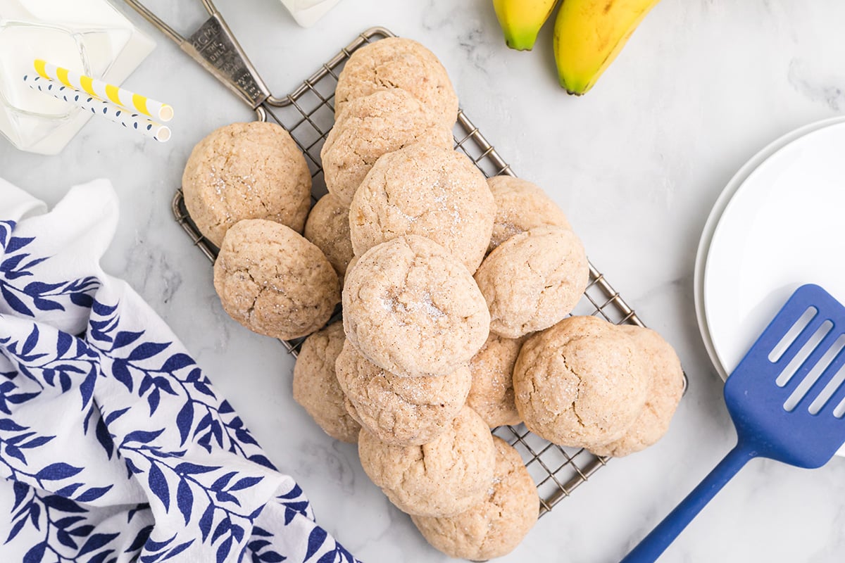 pile of banana cookies with blue line and spatula 