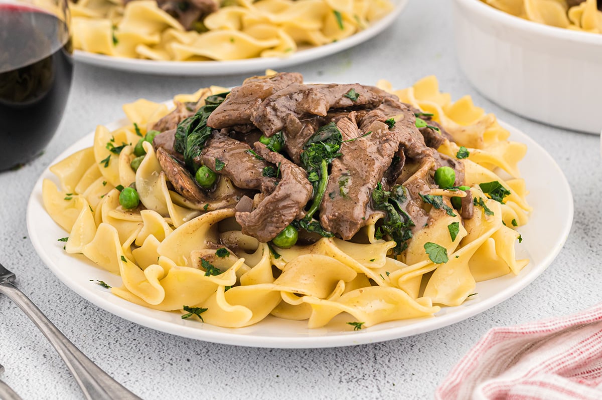 beef with noodles on a plate 