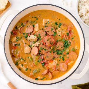 overhead bowl of chicken and sausage gumbo in a white bowl