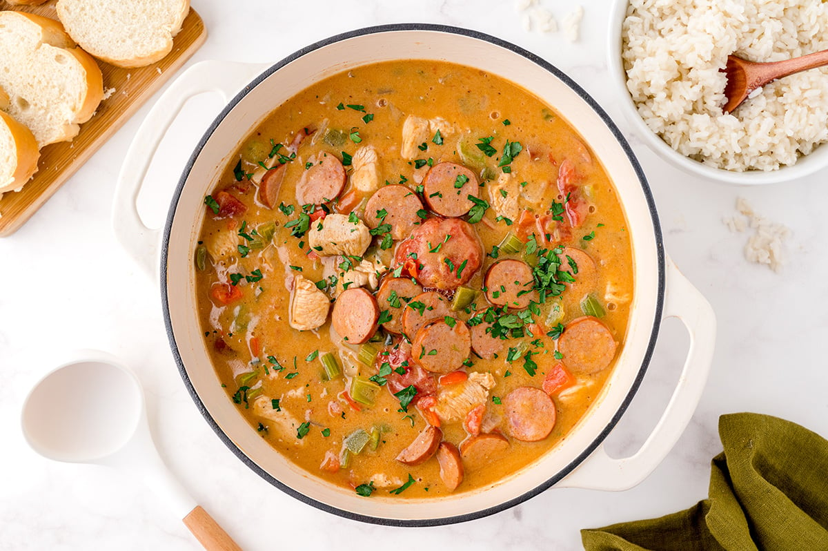 overhead bowl of chicken and sausage gumbo in a white bowl