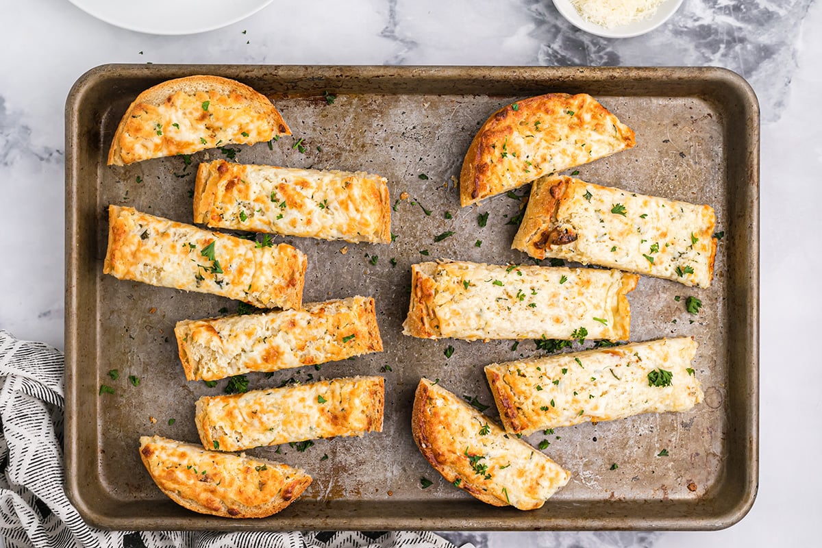 good garlic bread on a rimmed baking sheet 