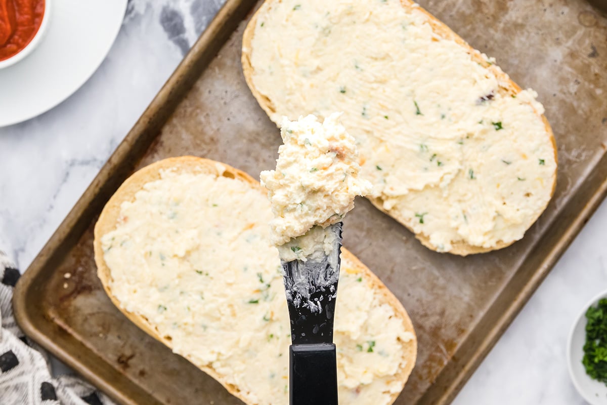 close up of garlic spread on a knife 