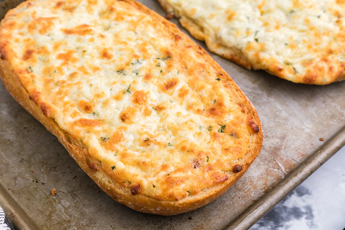 cheesy garlic bread on a sheet pan 