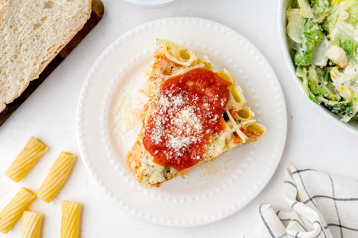 slice of honeycomb pasta pie on  white plate 