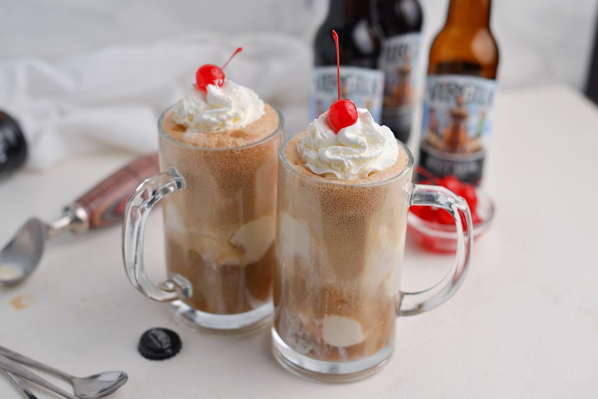 two mugs of frosty root beer floats 