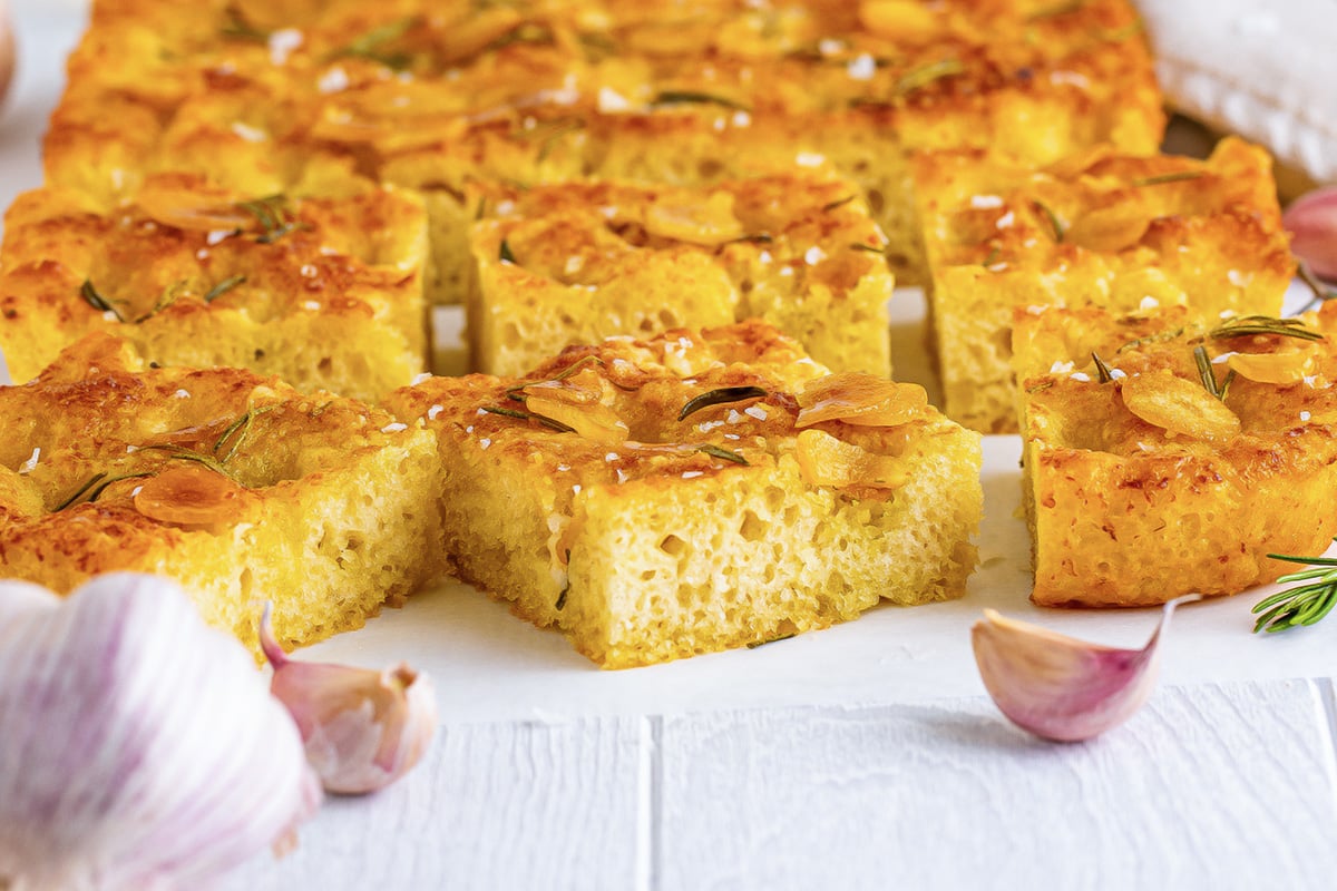 close up square of cut focaccia bread 