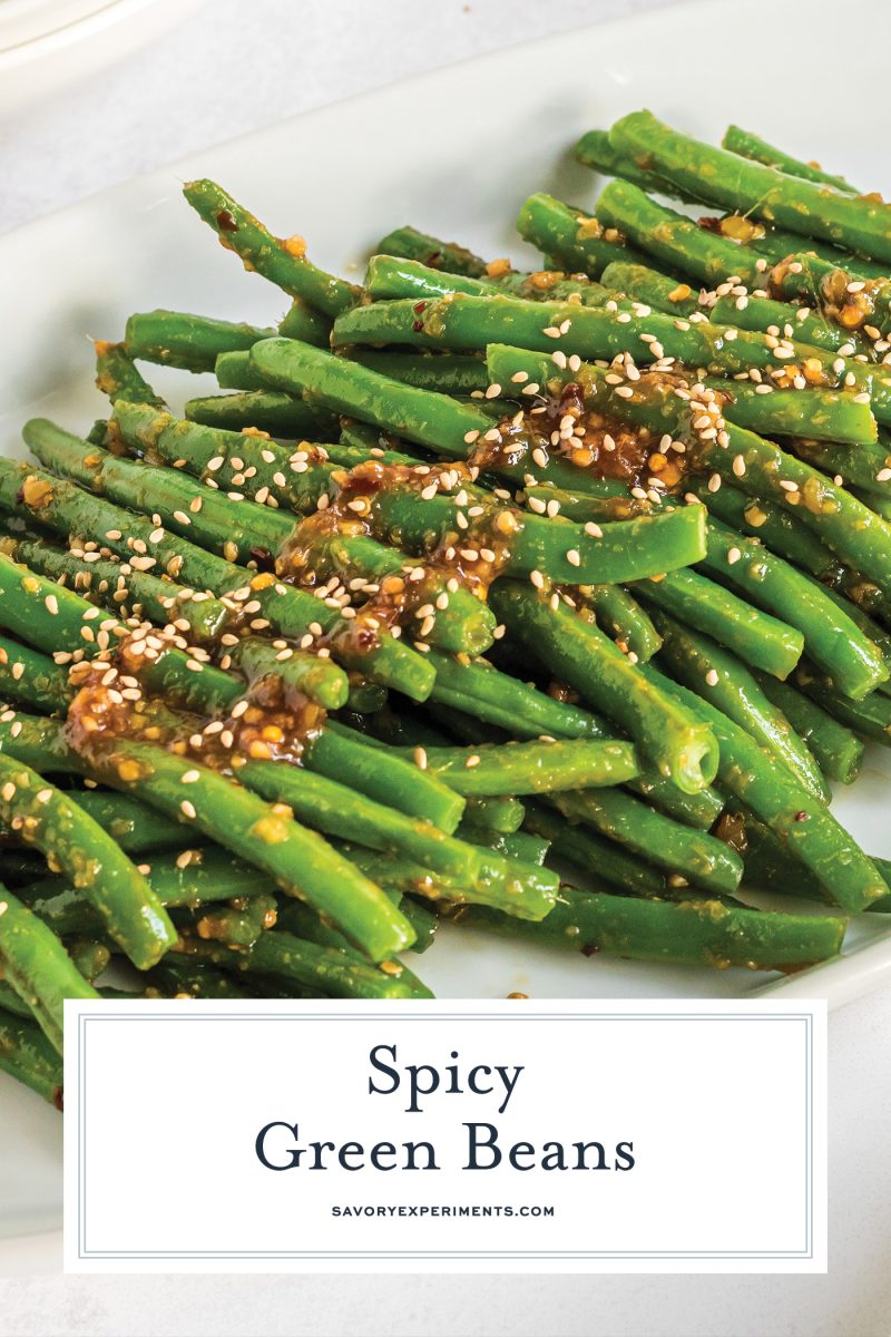 angled shot of spicy green beans on plate with text overlay