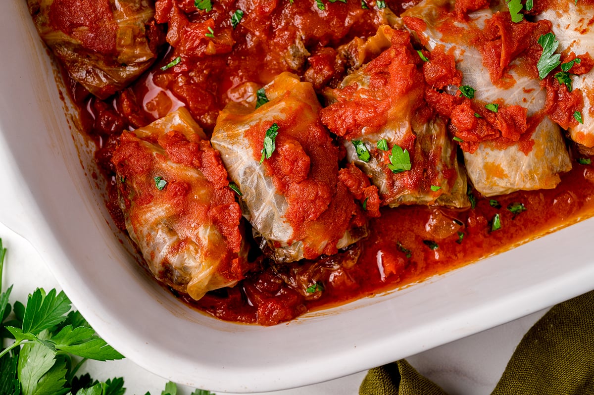 overhead shot of baking dish full of cabbage rolls at an angle