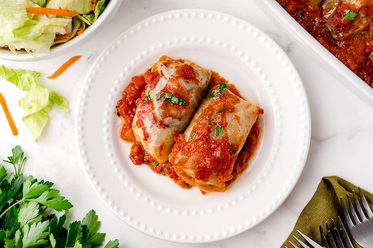 overhead shot of two cabbage rolls on a plate
