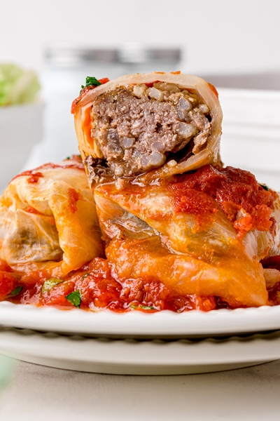half a cabbage roll stacked on two cabbage rolls