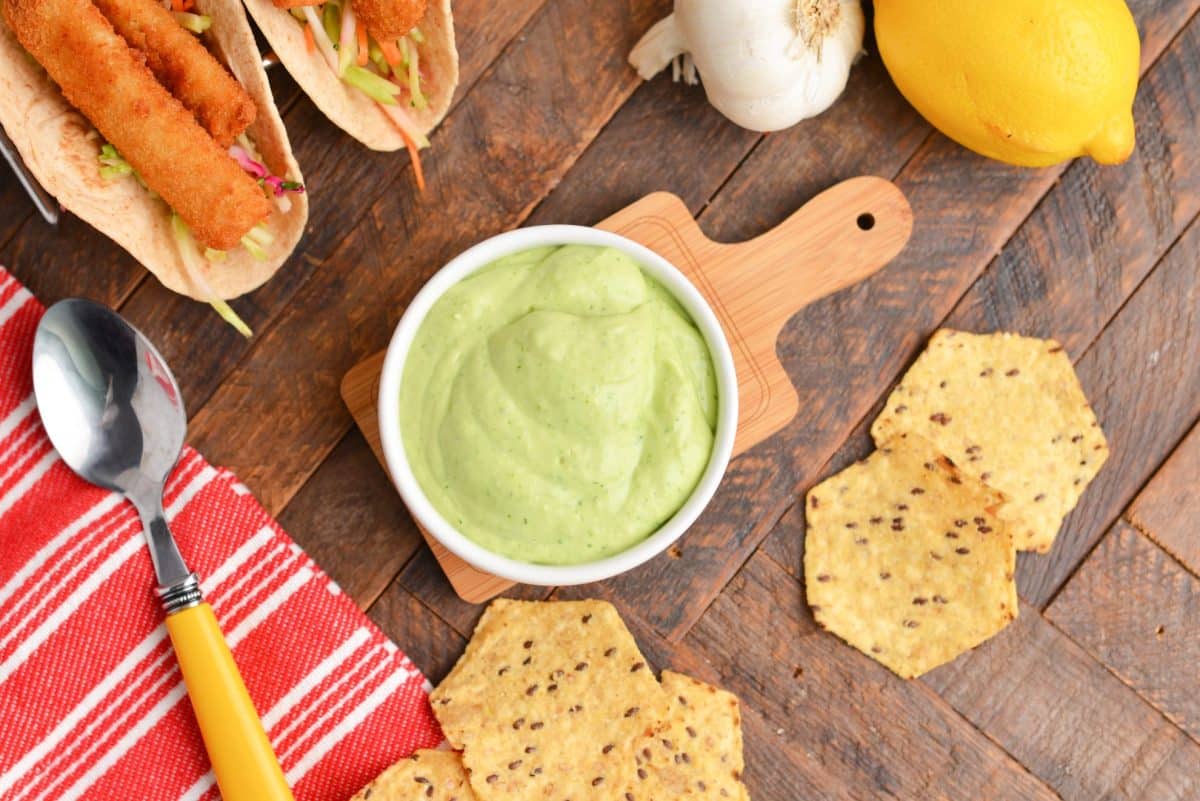 overhead of creamy green goddess dressing in a white bowl